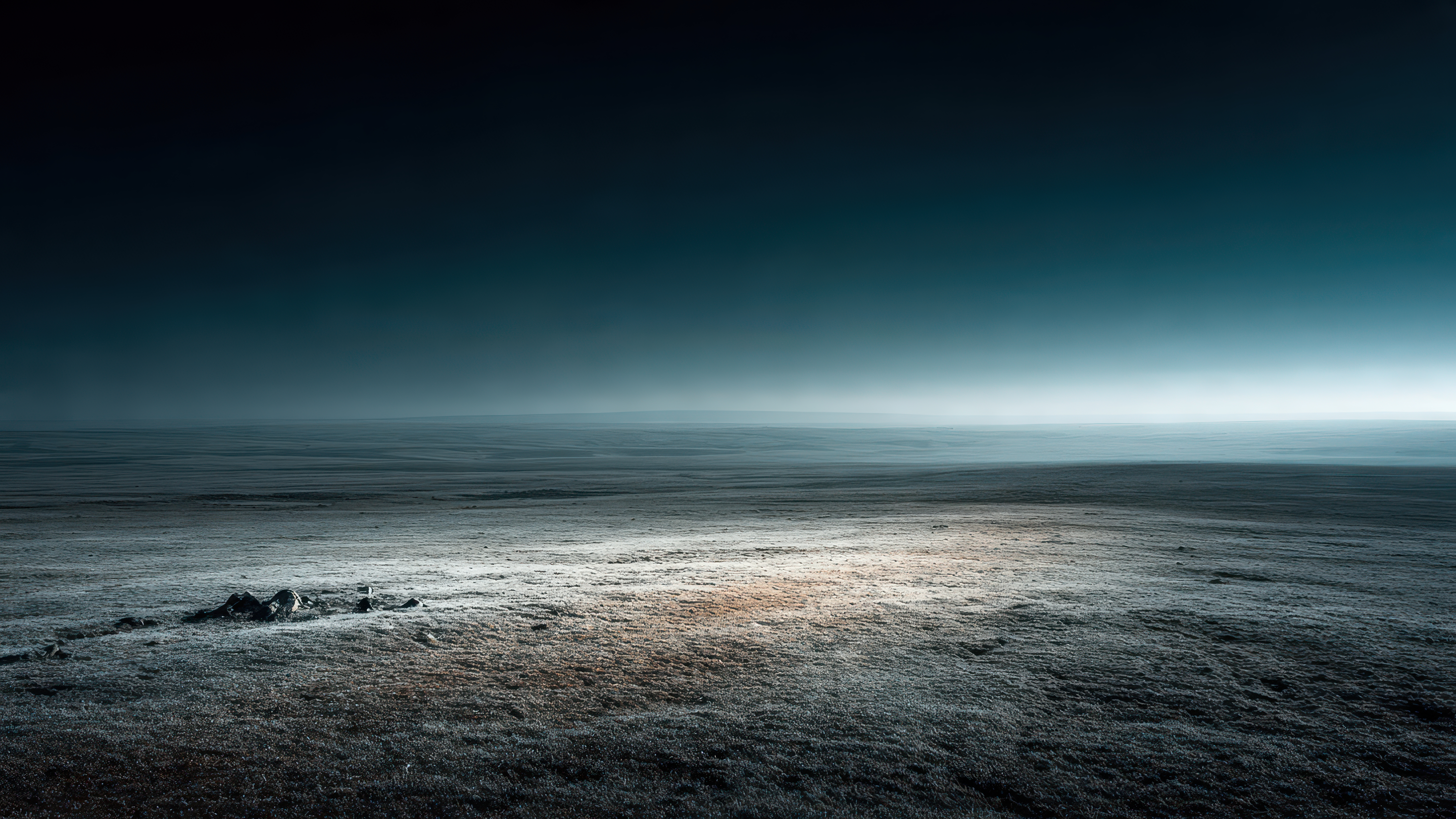 Expansive empty landscape under a dramatic sky